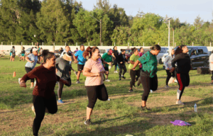 Community Zumba class taking place outdoors, encouraging participation and active living in Tonga.